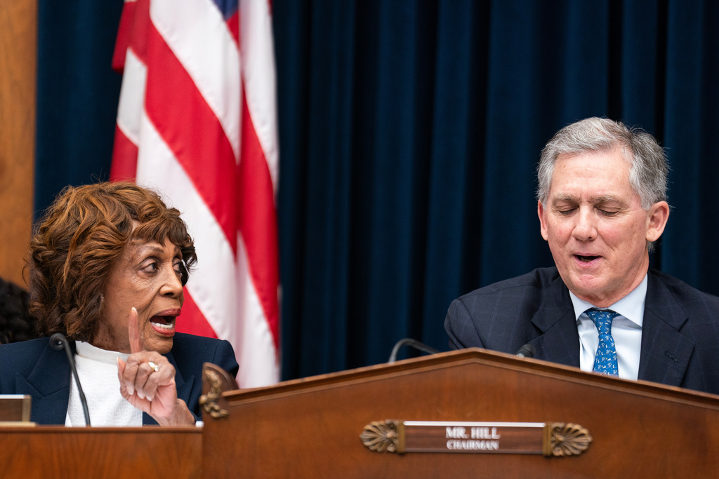 House Financial Services Committee Ranking Member Maxine Waters D-Calif., speaks with Chair French Hill R-Ark., during hearing featuring Secretary of the Treasury Scott Bessent on Capitol Hill in Washington, Wednesday, Feb. 4, 2026. (AP Photo/Nathan Howard)