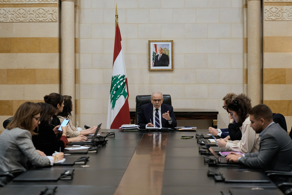 Lebanese Prime Minister Nawaf Salam meets with journalists working for foreign media and news agencies at the government palace in Beirut, Wednesday, Dec. 3, 2025. (AP Photo/Bilal Hussein)