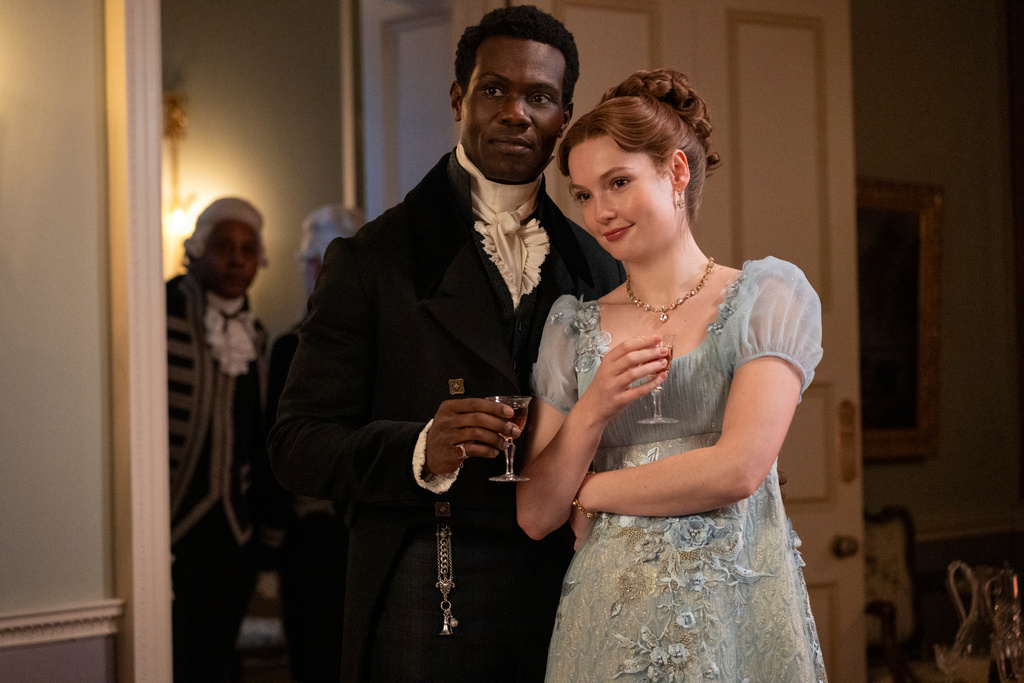 This image released by Netflix shows Victor Alli as John Stirling, left, and Hannah Dodd as Francesca Bridgerton in a scene from "Bridgerton." (Liam Daniel/Netflix via AP)