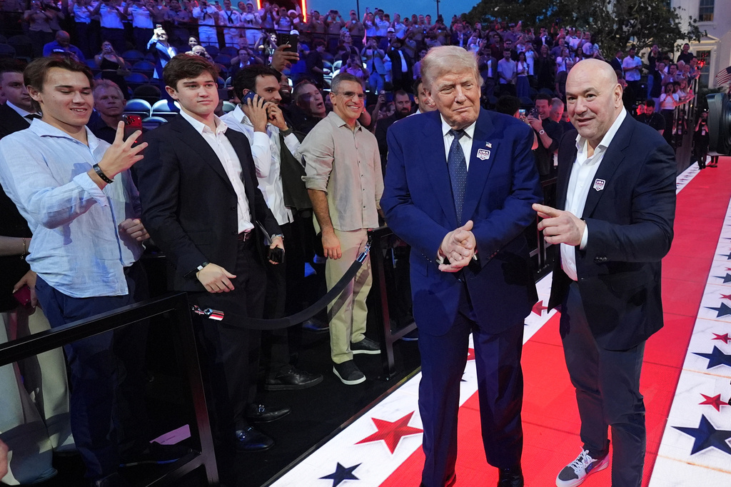 President Donald Trump and Dana White, UFC president and CEO, arrive for UFC Freedom 250 on the South Lawn of the White House, Sunday, June 14, 2026, in Washington. (AP Photo/Alex Brandon)