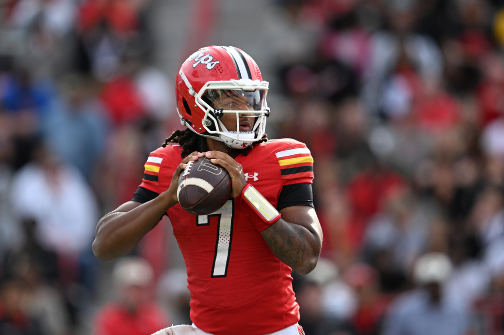 Maryland quarterback Malik Washington looks to throw a pass against Nebraska during the first half of an NCAA college football game, Saturday, Oct. 11, 2025, in College Park, Md. (AP Photo/Gail Burton)
