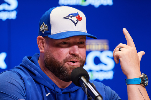Toronto Blue Jays manager John Schneider speaks with the media ahead of Game 1 of baseball's American League Championship Series against the Seattle Mariners in Toronto, Saturday, Oct. 11, 2025. (Sammy Kogan/The Canadian Press via AP) Toronto Blue Jays manager John Schneider speaks with the media ahead of Game 1 of baseball's American League Championship Series against the Seattle Mariners in Toronto, Saturday, Oct. 11, 2025. (Sammy Kogan/The Canadian Press via AP)