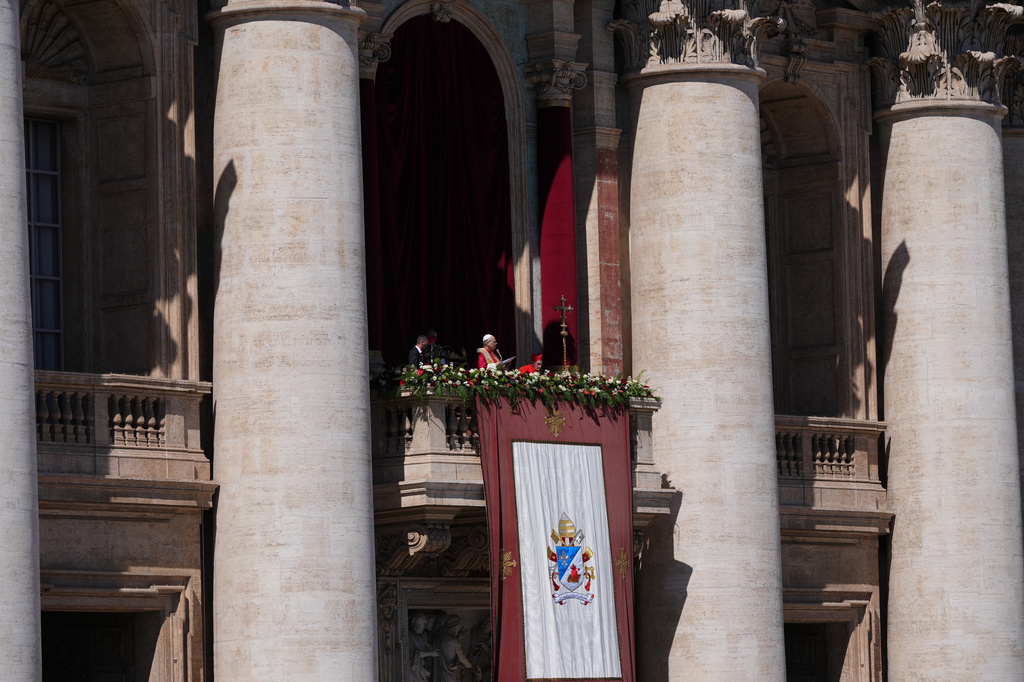 Pope Leo XIV addresses the faithful after delivering the Urbi et Orbi blessing - Latin for "to the city of Rome and to the world" - from the central loggia of St. Peter's Basilica at the end of Easter Mass he presided over in St. Peter's Square at the Vatican, Sunday, April 5, 2026. (AP Photo/Alessandra Tarantino)