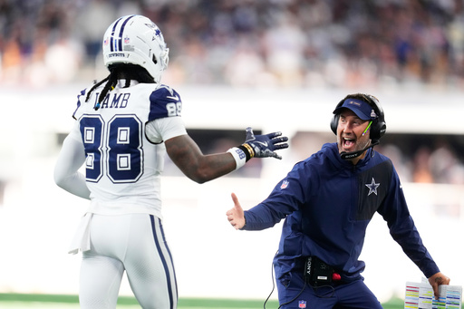 Dallas Cowboys head coach Brian Schottenheimer, right, greets wide receiver Ceedee Lamb (88) near the bench after a touchdown against the Washington Commanders during the second half of an NFL football game Sunday, Oct. 19, 2025, in Arlington, Texas. (AP Photo/Jeffrey McWhorter) Dallas Cowboys head coach Brian Schottenheimer, right, greets wide receiver Ceedee Lamb (88) near the bench after a touchdown against the Washington Commanders during the second half of an NFL football game Sunday, Oct. 19, 2025, in Arlington, Texas. (AP Photo/Jeffrey McWhorter)