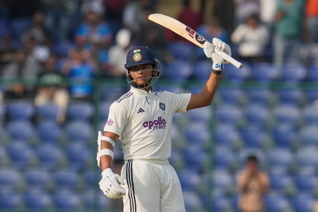 India's Yashasvi Jaiswal celebrates after scoring one hundred and fifty runs on the first day of the second cricket test match between India and West Indies at the Arun Jaitley Stadium in New Delhi, India, Friday, Oct.10, 2025. (AP Photo/Manish Swarup)