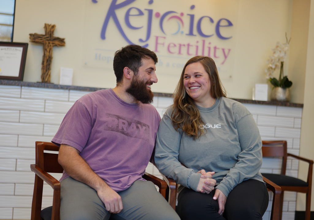 IVF patients Domenic and Olivia D'Agostino sit for a portrait at Rejoice Fertility, Jan. 8, 2026, in Knoxville, Tenn. (AP Photo/Jessie Wardarski)