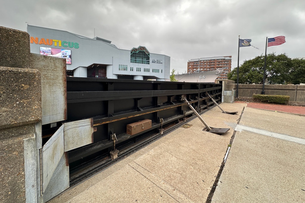 A flood gate blocks Main Street from the waterfront in Norfolk, Va., as a nor'easter works its way up the coast, Thursday, Sept. 24, 2026. (AP Photo/Allen G. Breed)