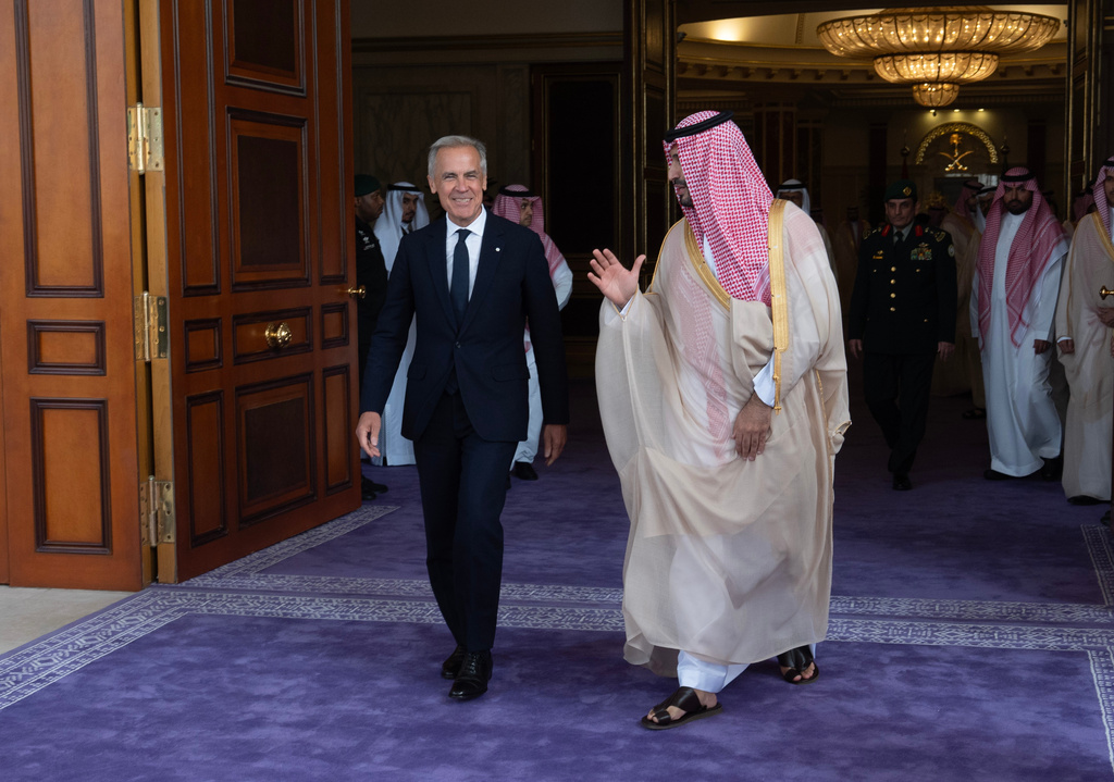 Canada Prime Minister Mark Carney, left, speaks with Saudi Arabia's Crown Prince Mohammed bin Salman as he leaves the Royal Palace in Jeddah, Saudi Arabia, Thursday, July 9, 2026. (Adrian Wyld/The Canadian Press via AP)