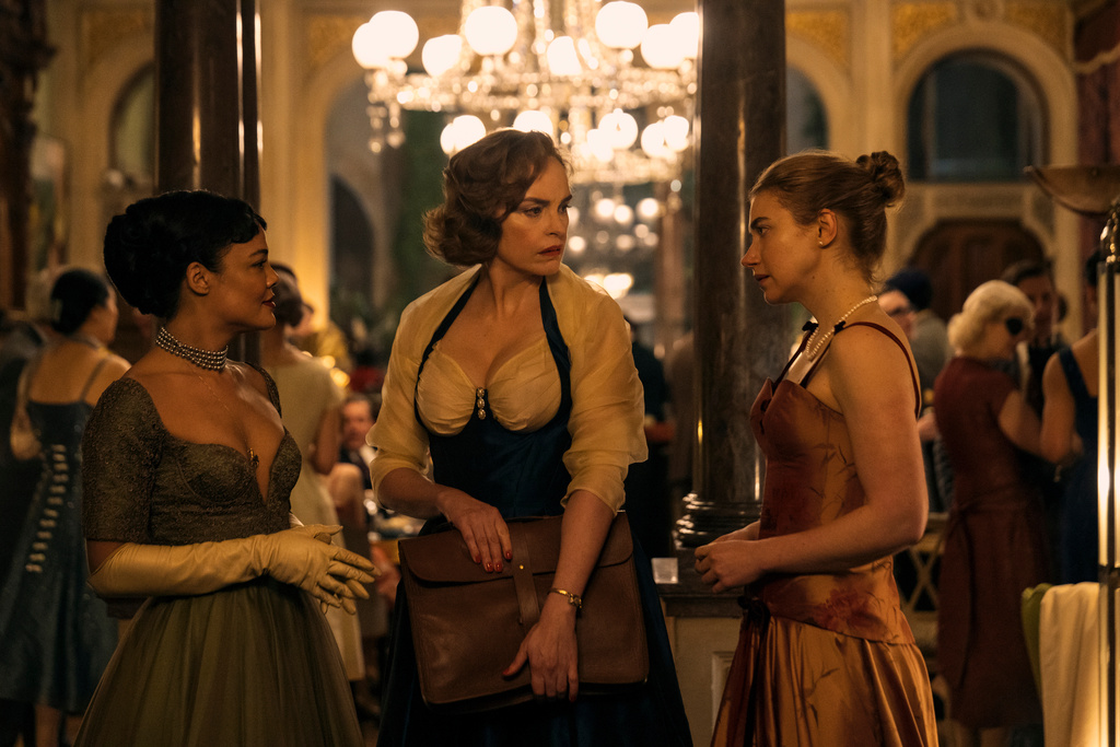 This image released by Amazon Prime shows Tessa Thompson, from left, Nina Hoss and Imogen Poots in a scene from "Hedda." (Parisa Taghizadeh/Amazon Prime via AP)