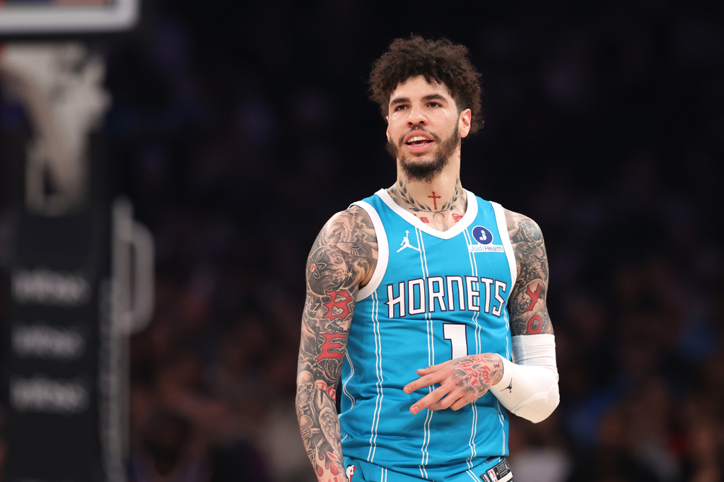 Charlotte Hornets' LaMelo Ball (1) reacts after scoring a three-point basket against the New York Knicks during the first half of an NBA basketball game, Sunday, April 12, 2026, in New York. (AP Photo/Pamela Smith)