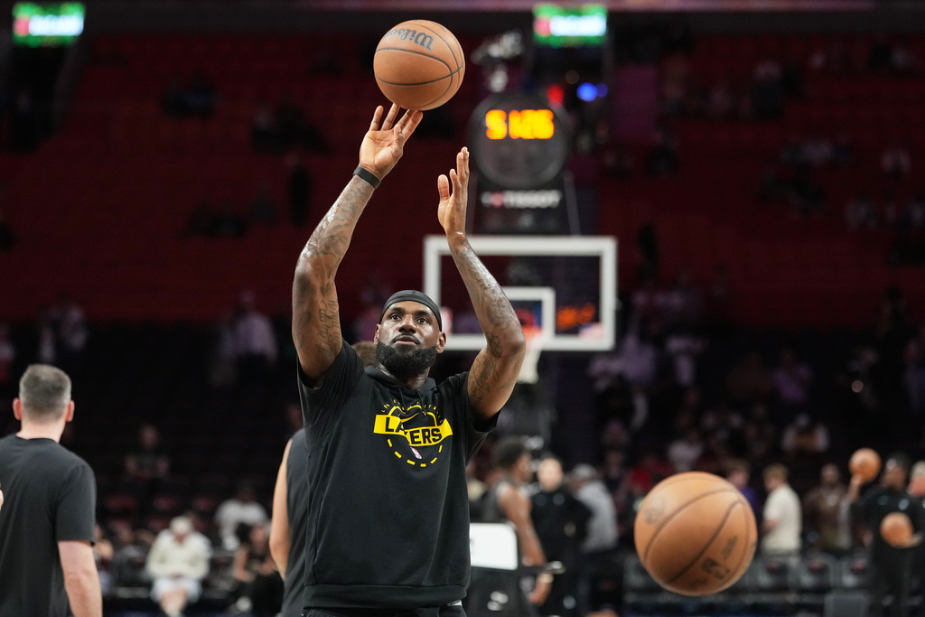 Los Angeles Lakers forward LeBron James warms up before an NBA basketball game against the Miami Heat, Thursday, March 19, 2026, in Miami. (AP Photo/Lynne Sladky)