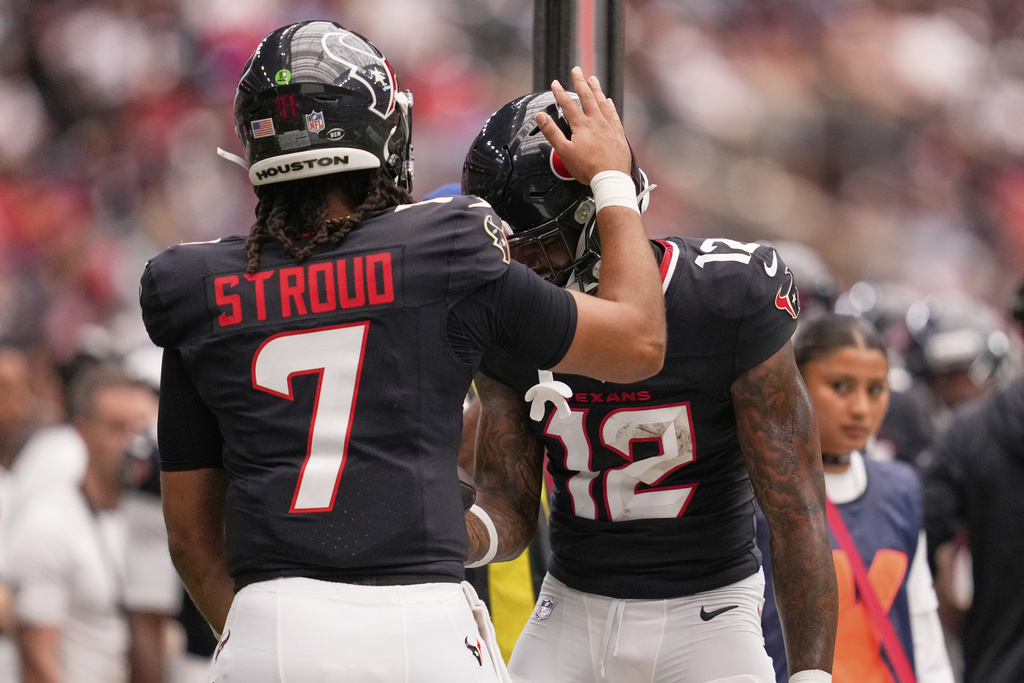 Houston Texans wide receiver Nico Collins celebrates after scoring with quarterback C.J. Stroud against the Carolina Panthers during the first half of an NFL preseason football game on Saturday, Aug. 16, 2025, in Houston. (AP Photo/Ashley Landis)
