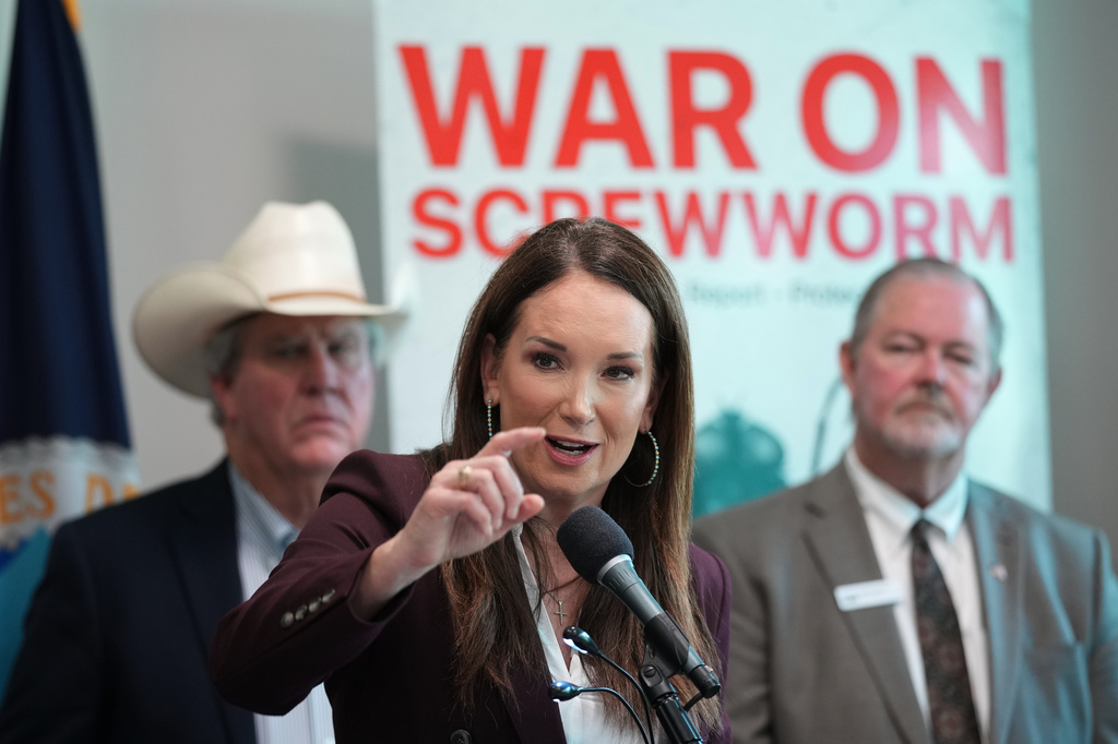 U.S. Agriculture Secretary Brooke Rollins, center, holds a news conference with ranchers, researchers and officials at the Knipling-Bushland U.S. Livestock Insects Research Laboratory in Kerrville, Texas, Monday, June 8, 2026. (AP Photo/Eric Gay)