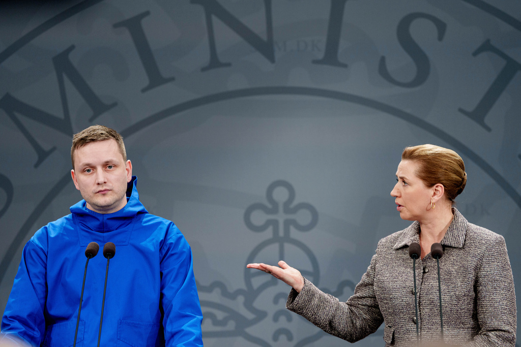 Chairman of the Naalakkersuisut, Greenland, Jens-Frederik Nielsen and Denmark's Prime Minister Mette Frederiksen, right, give a statement on the current situation at a press conference in the Mirror Hall at the Prime Minister's Office in Copenhagen, Tuesday, Jan. 13, 2026. (Liselotte Sabroe/Ritzau Scanpix via AP)