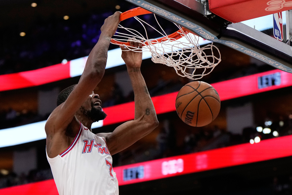 Houston Rockets forward Kevin Durant dunks during the second half of an NBA basketball game against the Milwaukee Bucks in Houston, Wednesday, April 1, 2026. (AP Photo/Ashley Landis)