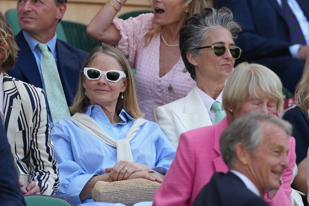 Actress Jodie Foster, left, and actress Alex Hedison sit in the royal box on day 13 of the Wimbledon Tennis Championships in London, Saturday, July 11, 2026. (AP Photo/Kirsty Wigglesworth)