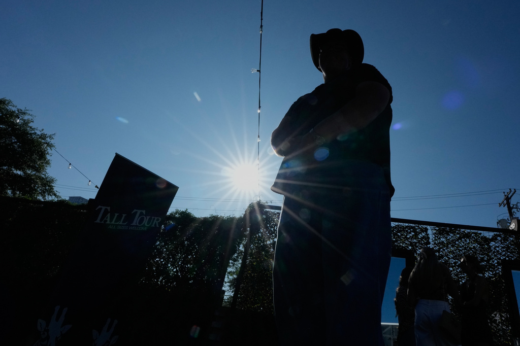 Sam Koban, who is 7 feet, 3 inches tall stands outside during a Tall Tour event Saturday, May 9, 2026, in Austin, Texas. (AP Photo/David J. Phillip)