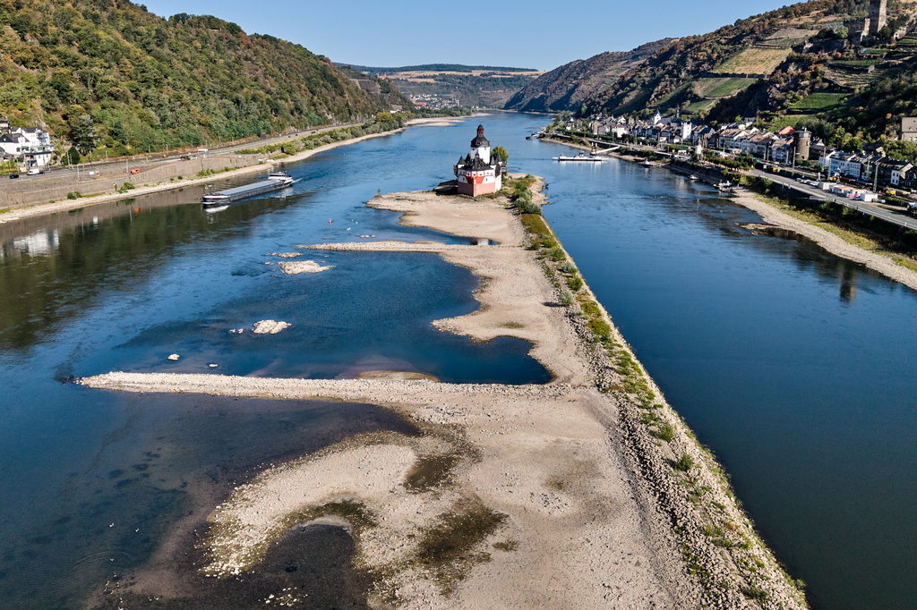 The Zollburg Pfalzgrafenstein toll castle is seen in the middle of the Rhine river with low water levels, in Kaub, Germany, Monday, Aug. 10, 2026. (AP Photo/Michael Probst)