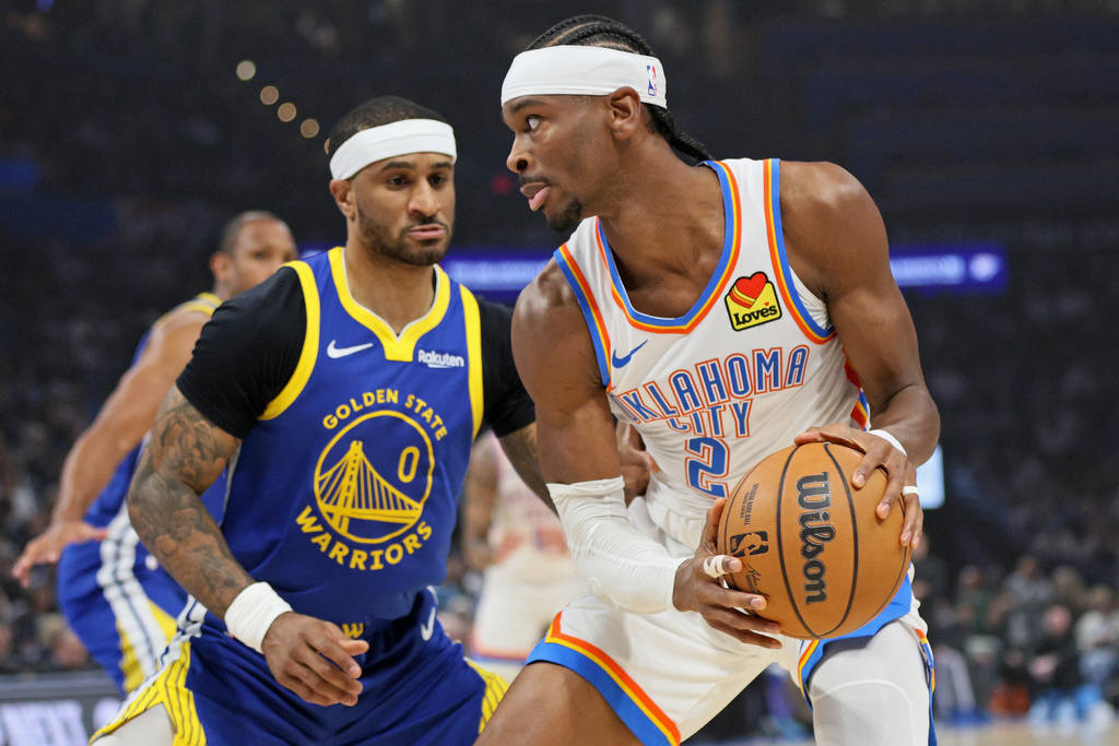 Oklahoma City Thunder guard Shai Gilgeous-Alexander (2) looks for an outlet against Golden State Warriors guard Gary Payton II (0) during the first half of an NBA basketball game Saturday, March 7, 2026, in Oklahoma City. (AP Photo/Nate Billings)