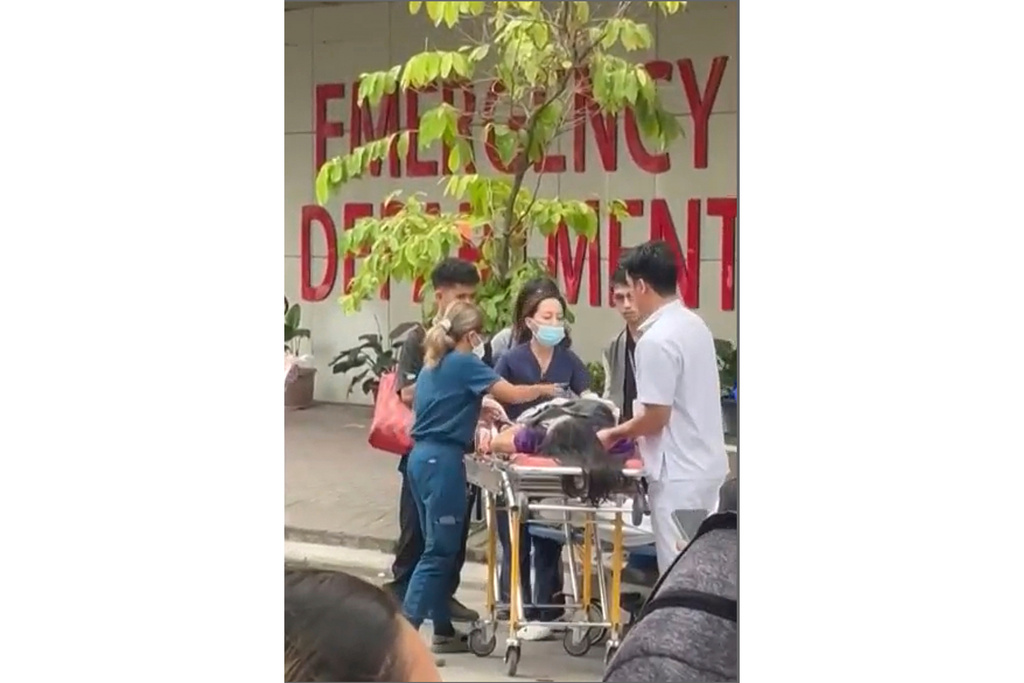 Health workers rush a person injured by an earhtquake to a hospital compound in Davao city, Philippines Friday, Oct. 10, 2025. (Meggy Macion Santos via AP)