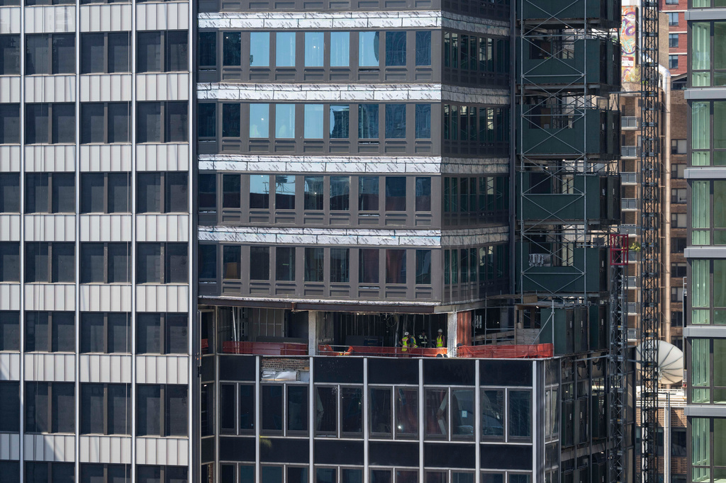 Sagging floors above a buckled support beam are seen inside 235 East 42nd Street, Wednesday, July 8, 2026, in New York. (AP Photo/Yuki Iwamura)
