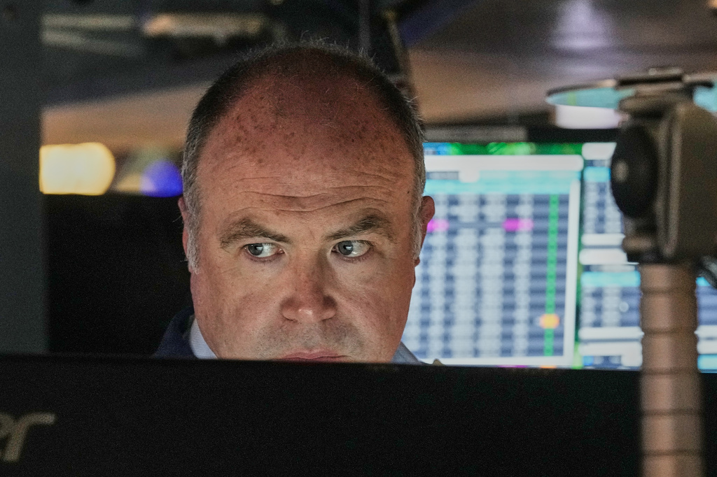 Trader Derek Orth works on the floor of the New York Stock Exchange, Thursday, April 30, 2026. (AP Photo/Richard Drew)