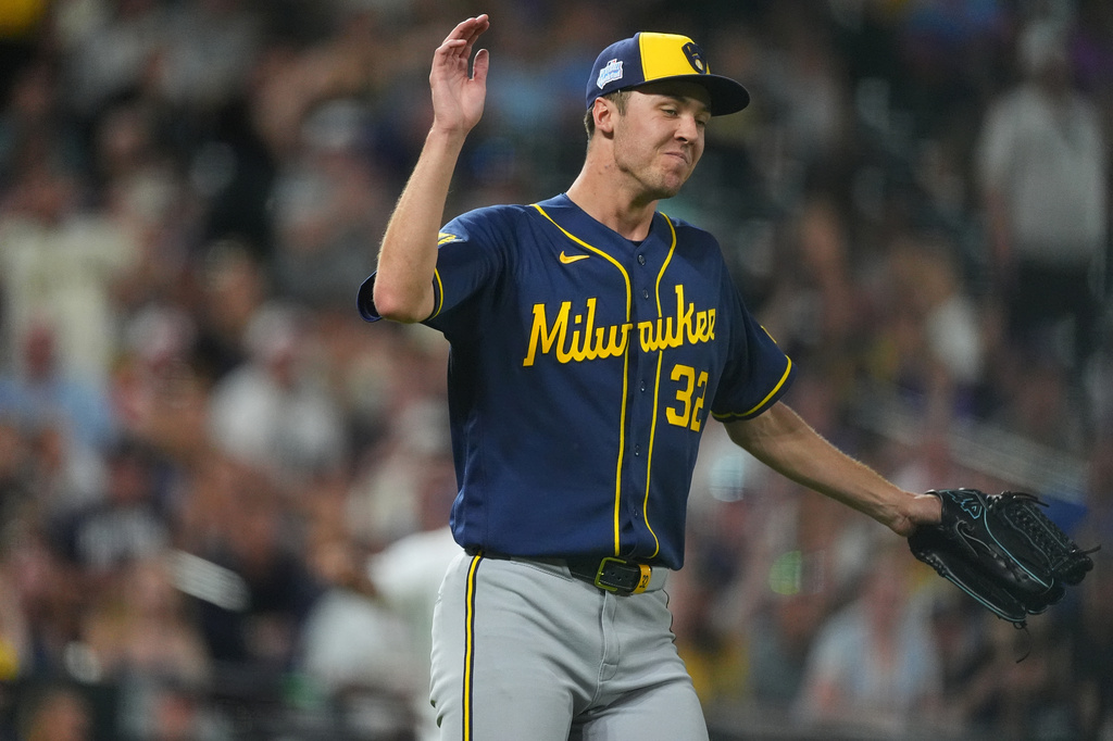Milwaukee Brewers starting pitcher Jacob Misiorowski reacts after getting out of a bases-loaded jam after Colorado Rockies' Ezequiel Tovar grounded out to end the sixth inning of a baseball game Saturday, June 6, 2026, in Denver. (AP Photo/David Zalubowski)