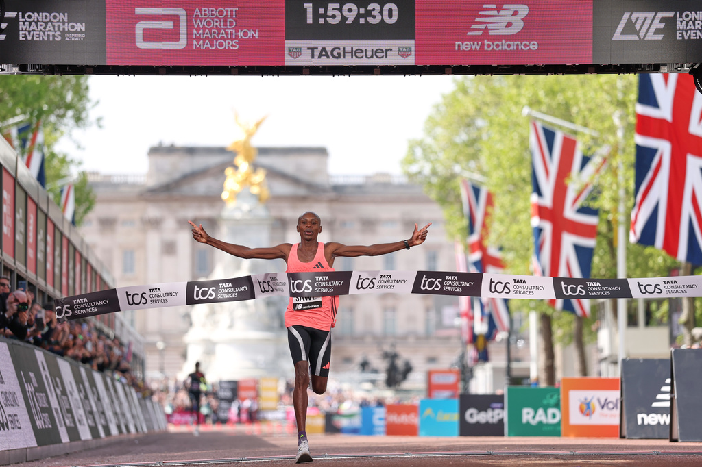 Sebastian Sawe from Kenya crosses the finish line to win the men's race at the London Marathon in London, Sunday, April 26, 2026.(AP Photo/Ian Walton)