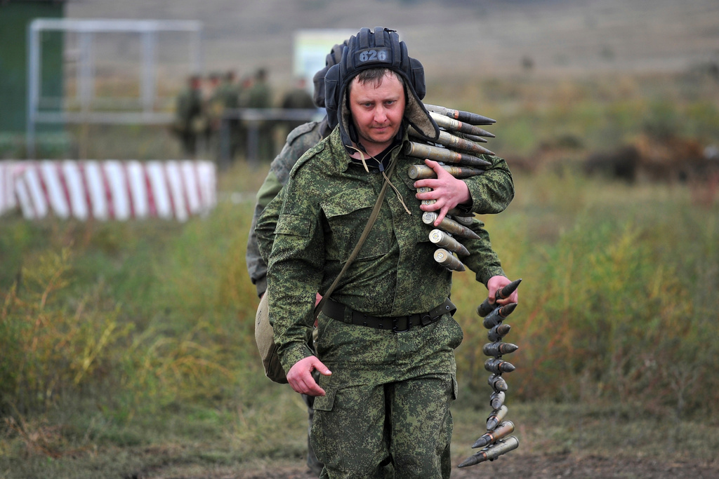 FILE- Recruits carry ammunition during training at a firing range in the Rostov-on-Don region of southern Russia, Tuesday, Oct. 4, 2022. (AP Photo, File)