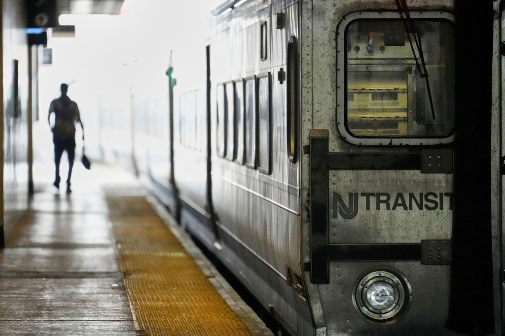 FILE - An NJ Transit train leaves the Secaucus Junction station in Secaucus, N.J., Wednesday, May 14, 2025. (AP Photo/Seth Wenig, File)