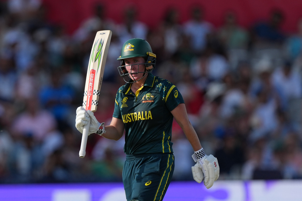 Australia's Beth Mooney, celebrates getting 50 not out during the Women's T20 Cricket World Cup final between England and Australia in London, Sunday, July 5, 2026. (AP Photo/Alastair Grant)