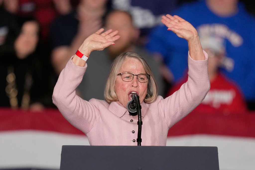 Rep. Mariannette Miller-Meeks, R-Iowa, speaks before President Donald Trump arrives at a rally, Tuesday, Jan. 27, 2026, in Clive, Iowa. (AP Photo/Charlie Neibergall)