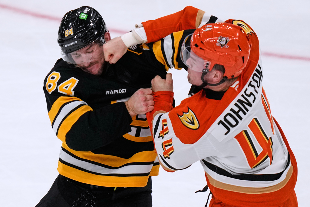 Anaheim Ducks left wing Ross Johnston (44) lands a punch in a fight against Boston Bruins left wing Tanner Jeannot (84) during the second period of an NHL hockey game, Thursday, Oct. 23, 2025, in Boston. (AP Photo/Charles Krupa)