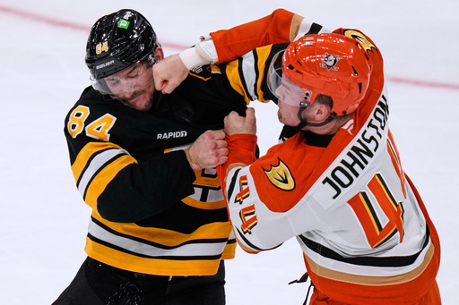 Anaheim Ducks left wing Ross Johnston (44) lands a punch in a fight against Boston Bruins left wing Tanner Jeannot (84) during the second period of an NHL hockey game, Thursday, Oct. 23, 2025, in Boston. (AP Photo/Charles Krupa) Anaheim Ducks left wing Ross Johnston (44) lands a punch in a fight against Boston Bruins left wing Tanner Jeannot (84) during the second period of an NHL hockey game, Thursday, Oct. 23, 2025, in Boston. (AP Photo/Charles Krupa)