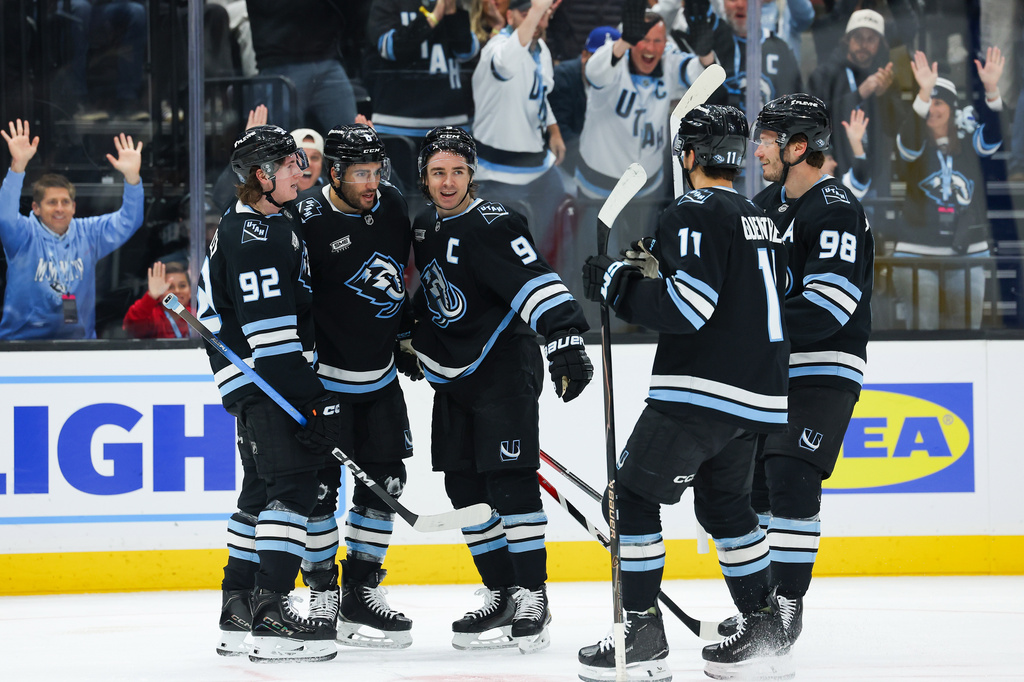 Utah Mammoth players celebrate a goal by center Nick Schmaltz (8) during the third period of an NHL hockey game against the Winnipeg Jets, Tuesday, April 14, 2026, in Salt Lake City. (AP Photo/Melissa Majchrzak)