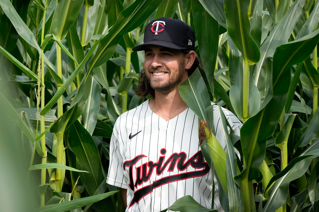Minnesota Twins pitcher Dean Kremer poses for a photo in a cornfield before a baseball game against the Philadelphia Phillies at the Field of Dreams movie site, Thursday, Aug. 13, 2026, in Dyersville, Iowa. (AP Photo/Charlie Neibergall)