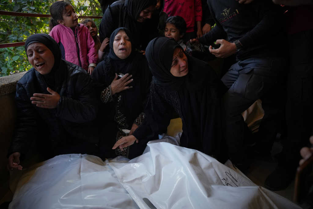 Mourners attend the funeral of Palestinians killed in an Israeli military strike, at Nasser Hospital in Khan Younis, Gaza Strip, Thursday, Dec. 4, 2025. (AP Photo/Abdel Kareem Hana)