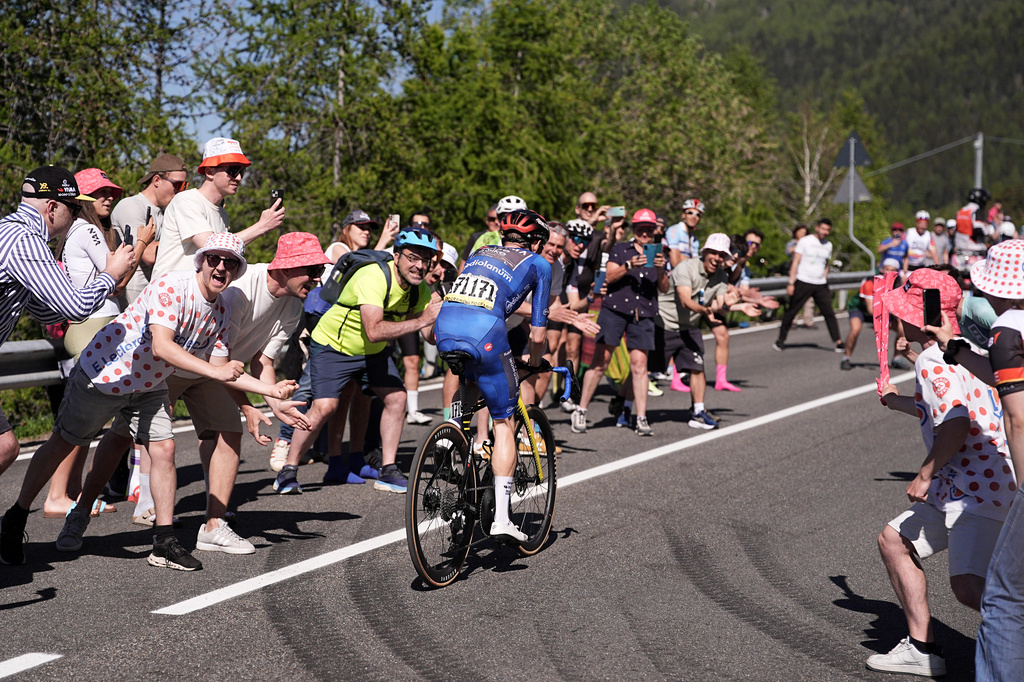 Denmark's Jonas Vingegaard is cheered by spectators on his way to win the 14th stage of the Giro d'Italia cycling race, from Aosta to Pila, Italy, Saturday, May 23, 2026. (Marco Alpozzi/LaPresse via AP)