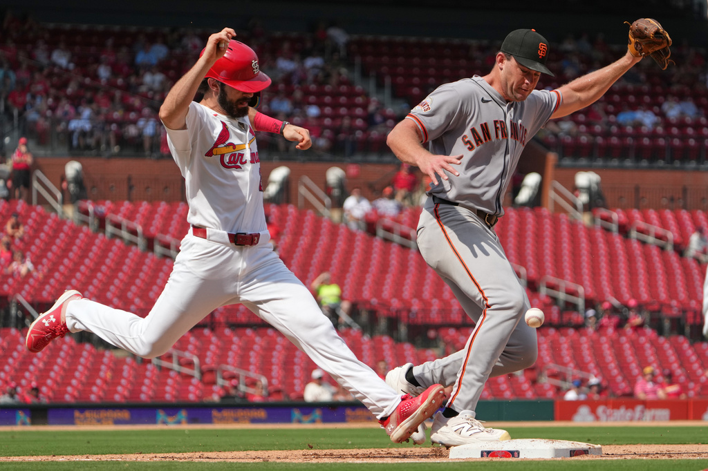 St. Louis Cardinals' Thomas Saggese, left, reaches base on an error by San Francisco Giants pitcher Carson Seymour during the seventh inning of a baseball game Wednesday, Sept. 16, 2026, in St. Louis. (AP Photo/Jeff Roberson)