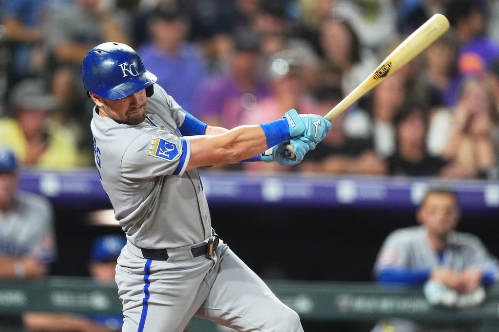 Kansas City Royals' Lane Thomas singles off Colorado Rockies starting pitcher Tomoyuki Sugano in the sixth inning of a baseball game Friday, July 31, 2026, in Denver. (AP Photo/David Zalubowski)