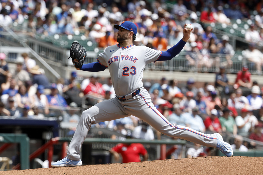 New York Mets pitcher David Peterson throws during the first inning of a baseball game against the Atlanta Braves, Sunday, Aug. 24, 2025, in Atlanta. (AP Photo/Butch Dill)