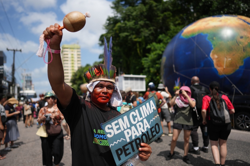 Indigenous activists participate in a climate protest during the COP30 U.N. Climate Summit, Monday, Nov. 17, 2025, in Belem, Brazil. (AP Photo/Andre Penner)