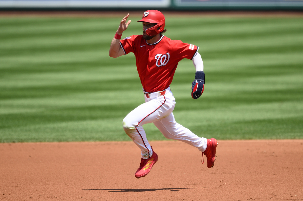 Washington Nationals' Dylan Crews runs to third base on a single by Jorbit Vivas during the second inning of a baseball game against the Cincinnati Reds, Sunday, Aug. 9, 2026, in Washington. (AP Photo/Nick Wass)