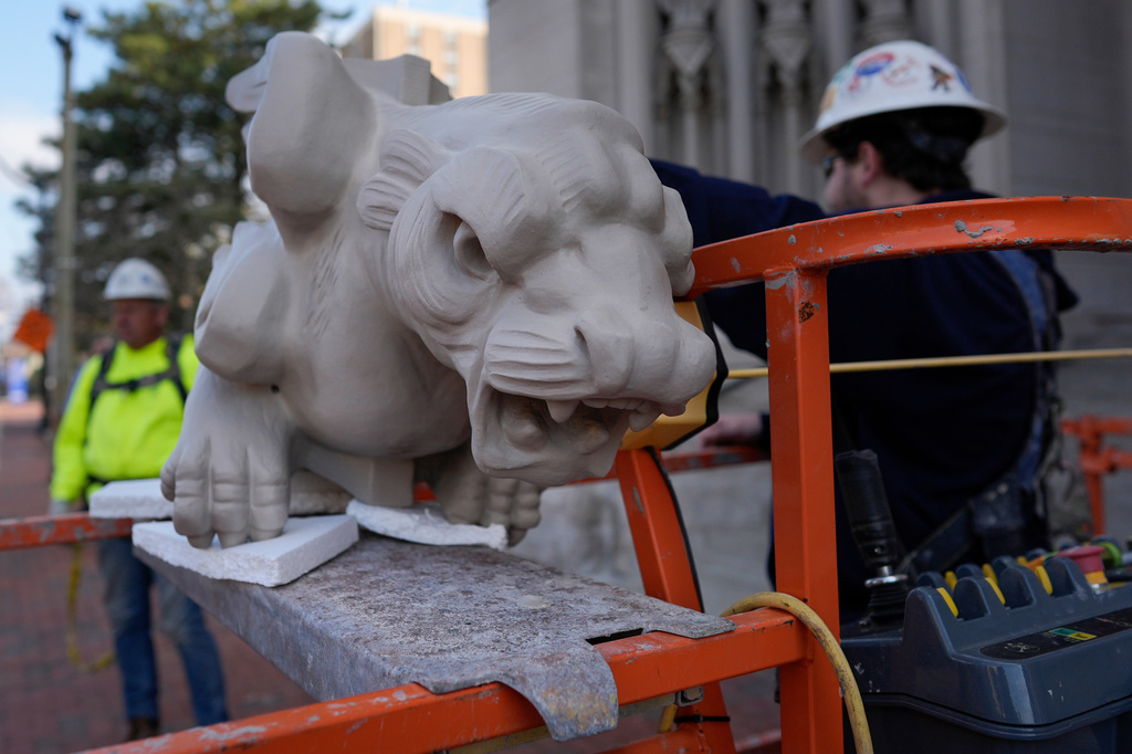 The final new terra cotta gargoyle is prepared for installation high on the Cathedral Basilica of the Assumption, known as "America's Notre Dame," in Covington, Ky., on Monday, March 30, 2026. (AP Photo/Carolyn Kaster)