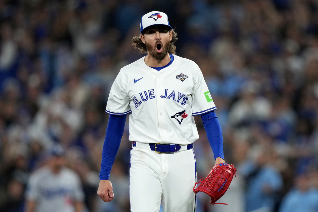 Toronto Blue Jays pitcher Kevin Gausman (34) celebrates retiring the Los Angeles Dodgers during the fourth inning in Game 2 of baseball's World Series, Saturday, Oct. 25, 2025, in Toronto. (Nathan Denette/The Canadian Press via AP)