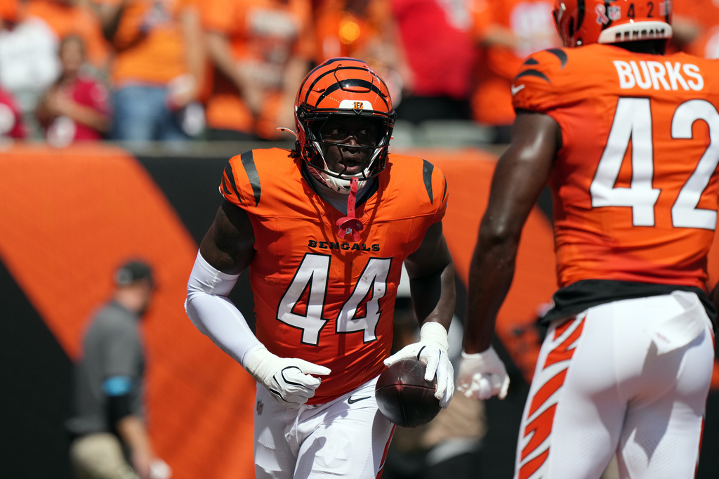 Cincinnati Bengals linebacker Demetrius Knight Jr. (44) runs to the sideline after recovering a fumble and running it in for a touchdown in the first half of an NFL football game against the Tampa Bay Buccaneers Sunday, Sept. 13, 2026, in Cincinnati. (AP Photo/Carolyn Kaster)