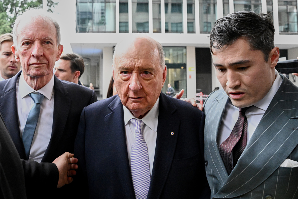 Former Australian rugby coach and broadcaster Alan Jones, center, arrives at Downing Centre Local Court in Sydney, Australia Monday, Aug. 3, 2026. (Bianca De Marchi/AAP Image via AP)