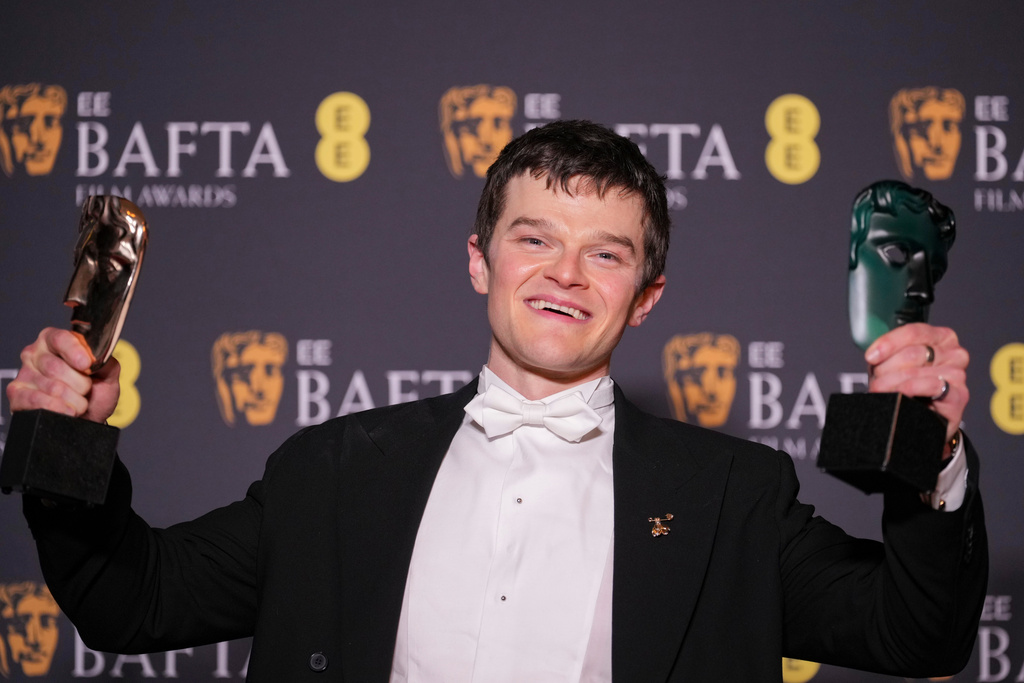 Robert Aramayo poses with the EE rising star award and the award for leading actor for 'I Swear' at the 79th British Academy Film Awards, BAFTA's, in London, Sunday, Feb. 22, 2026. (AP Photo/Alastair Grant)