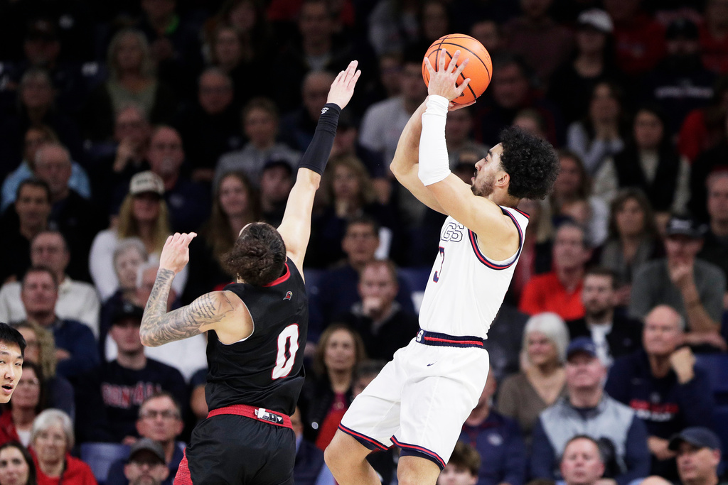 Gonzaga guard Braeden Smith, right, shoots while pressured by Seattle guard Brayden Maldonado (0) during the second half of an NCAA college basketball game, Friday, Jan. 2, 2026, in Spokane, Wash. (AP Photo/Young Kwak)