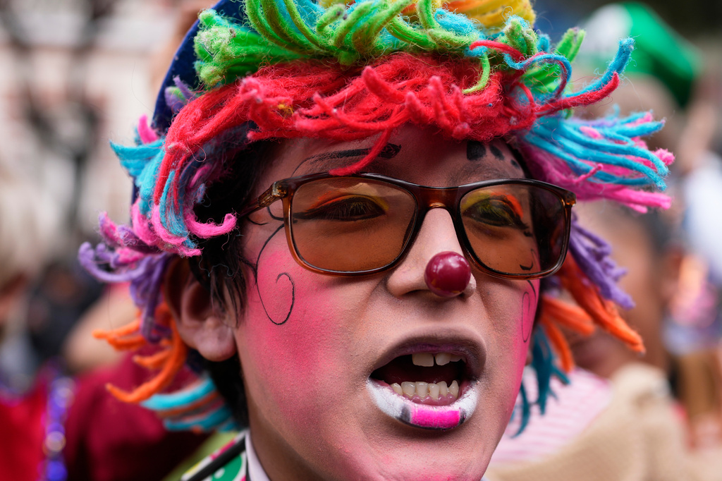 A clown shouts slogans during a protest against the government's ban on holiday parties at schools during teaching hours, outside the Ministry of Education in La Paz, Bolivia, Monday, March 30, 2026. (AP Photo/Juan Karita)
